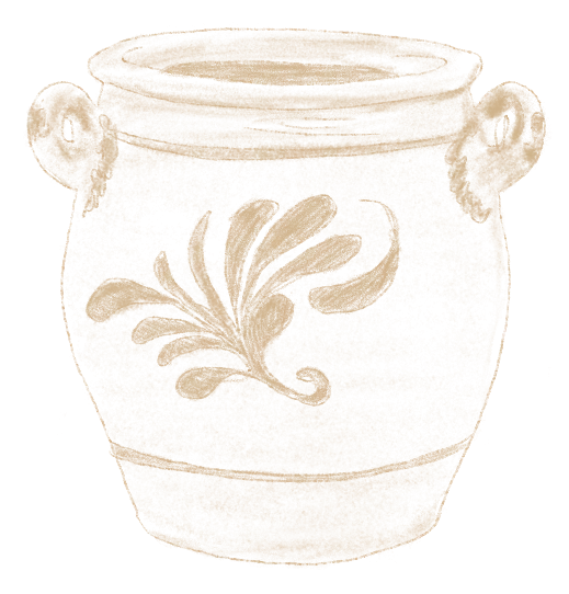 Un pot en céramique blanc avec des anses et un motif floral peint en brun