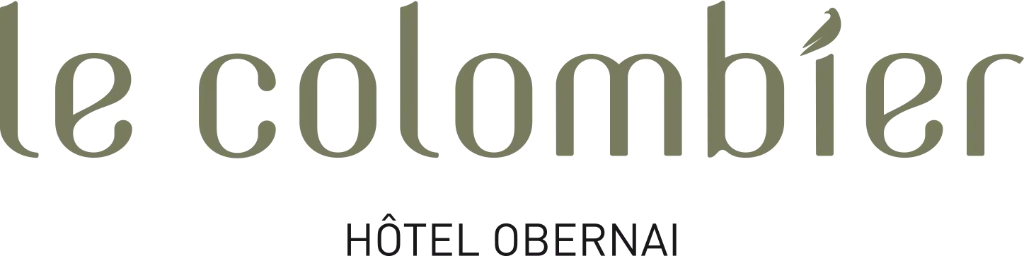 Logo de l'hôtel Le Colombier, avec un oiseau stylisé intégré dans la lettre "i"