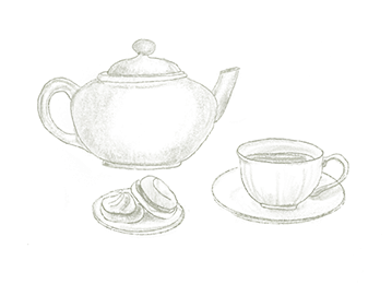 Une théière, une tasse de thé et deux biscuits sont disposés sur une surface