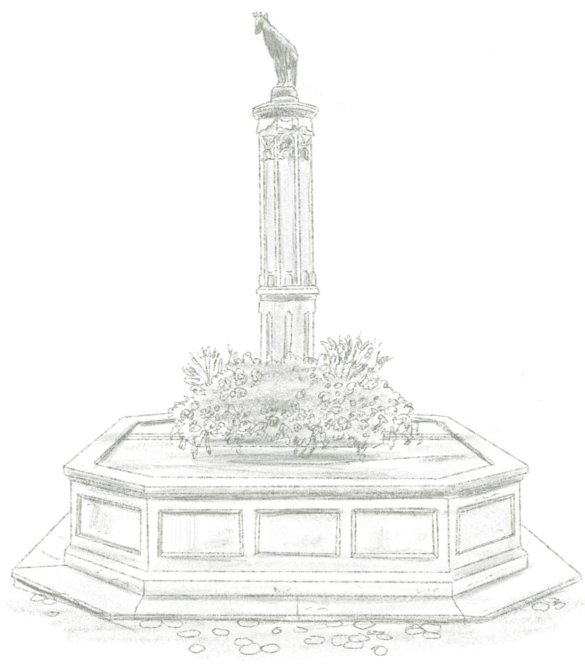 Un monument avec une statue équestre au sommet, entouré de fleurs, sur une base octogonale